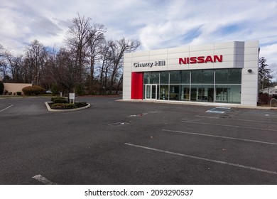 Cherry Hill, New Jersey - December, 2021: A Nissan Car Dealership With Its Parking Lot Almost Empty Due To A Supply Chain Disruptions Of Materials Used To Manufacture New Cars