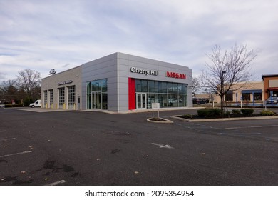 Cherry Hill, New Jersey - December, 2021: A Nissan Car Dealership With Its Parking Lot Almost Empty Due To A Supply Chain Disruptions Of Materials Used To Manufacture New Cars