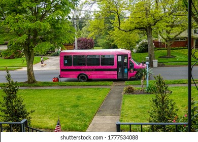 Cherry Hill, New Jersey - July, 2020: A Pink School Bus Used As A Dog Grooming Spa Parked On A Street In Front Of A House