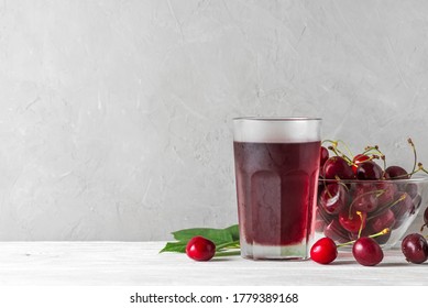 Cherry Juice In A Glass With Fresh Berries On White Background. Refreshment Summer Drink. Healthy Drink