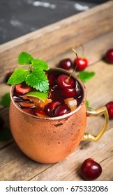 Cherry Moscow Mule On The Wooden Background.