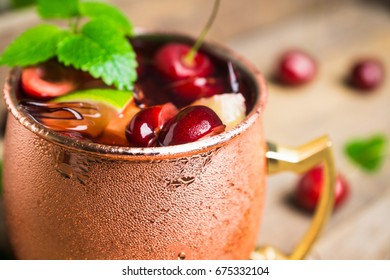 Cherry Moscow Mule On The Wooden Background. 