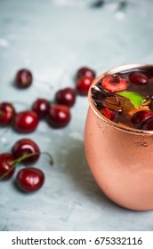 Cherry Moscow Mule On The Wooden Background. 