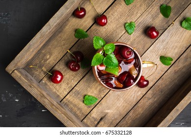 Cherry Moscow Mule On The Wooden Background.