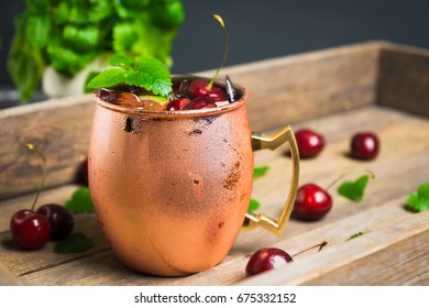 Cherry Moscow Mule On The Wooden Background.