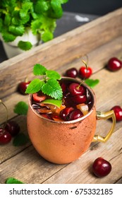 Cherry Moscow Mule On The Wooden Background. 