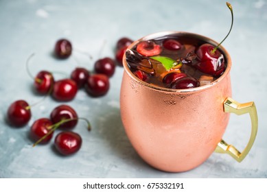 Cherry Moscow Mule On The Wooden Background.