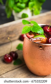 Cherry Moscow Mule On The Wooden Background.