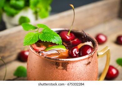 Cherry Moscow Mule On The Wooden Background.