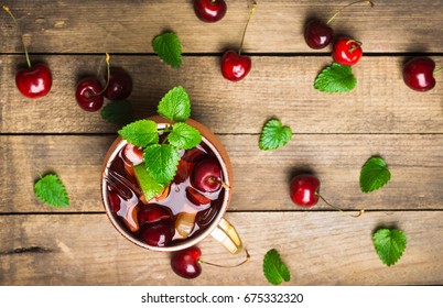 Cherry Moscow Mule On The Wooden Background.