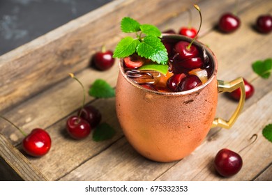 Cherry Moscow Mule On The Wooden Background. 