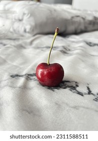 cherry on the bed is red