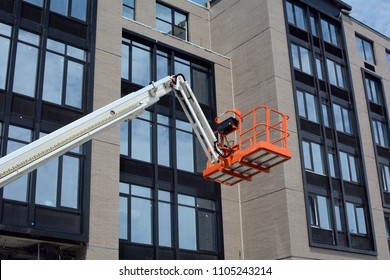 Cherry Picker At New Building Construction Site