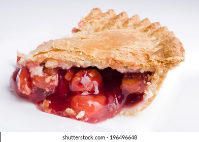 Cherry Pie With Filling Spilling Out Of The Flaky Crust.