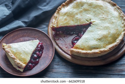 Cherry pie on the wooden background