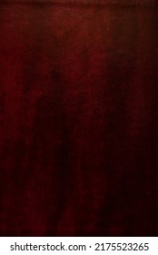 Cherry red brown leather texture. Bible leather cover background. Old deep crimson colored leather. Light top, darker bottom.