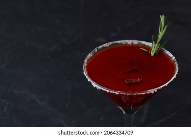 cherry tomato juice.close-up Bloody Mary cocktail. Alcoholic drink with vodka and tomato juice in a glass isolated on a black background. vampiro cocktail with pepper on table. copy space.