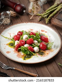 Cherry Tomato And Mozzarella Cheese Salad On Wooden Background