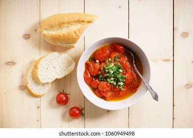 Cherry Tomato Salad  Vinaigrette In Bowl On Wooden Table