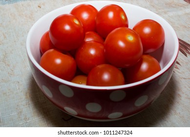 the cherry tomatoes in a red Cup with white polka dots
 - Powered by Shutterstock