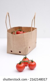 Cherry Tomatoes In A Small Brown Paper Bag