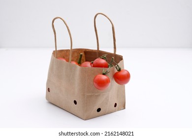 Cherry Tomatoes In A Small Brown Paper Bag