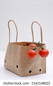 Cherry Tomatoes In A Small Brown Paper Bag