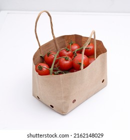 Cherry Tomatoes In A Small Brown Paper Bag