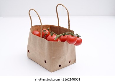 Cherry Tomatoes In A Small Brown Paper Bag