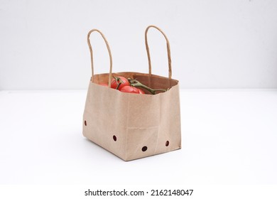 Cherry Tomatoes In A Small Brown Paper Bag