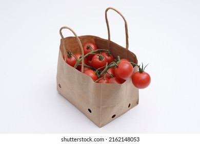 Cherry Tomatoes In A Small Brown Paper Bag