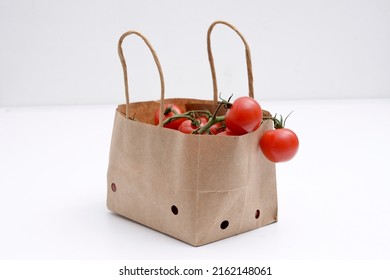 Cherry Tomatoes In A Small Brown Paper Bag