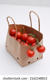 Cherry Tomatoes In A Small Brown Paper Bag