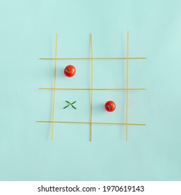 Cherry tomatoes, spaghetti and rosemary leaf composed against pastel blue background. Creative idea for basic pasta tomato sauce recipe.  - Powered by Shutterstock