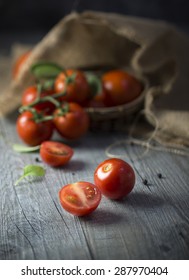 Cherry Tomatos On Wooden Counter Top. Rustic Kitchen. Close-up.