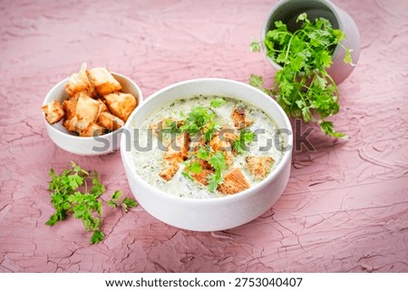 Chervil creamy blend vegetable soup with fresh made roasted whte bread croutons