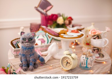 The Cheshire Cat, 
a character based on the Lewis Carroll fairy tale Alice in Wonderland.  Mad tea party.