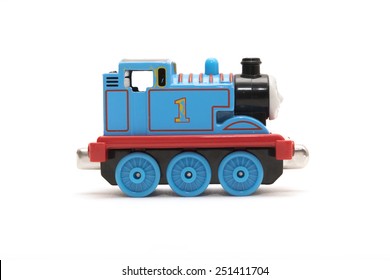 CHESHIRE, UK - February 9 2015. Thomas The Tank Engine Toy, Based On Children's Books By The Reverend Wilbert Awdry Isolated On White Background