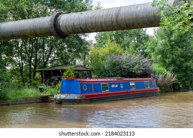 Cheshire,UK,June 2022.  Large Tubed Water Supply Pipeline Crosses Over Shropshire Union Canal