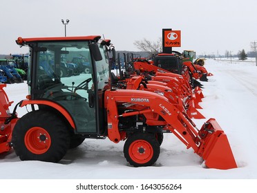 Chesley, Ontario / Canada - February 9, 2020: Row Of Kubota Farm Equipment On Lot In Snow