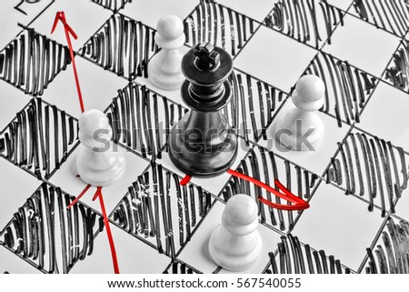 Chess. The black King is under attack. White board with chess figures on it. Helpmate or checkmate.