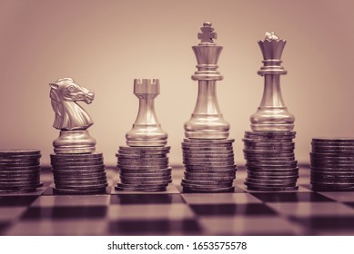 Chess Board Game To Represent The Business Strategy With Competition In The World Market. And Find Out The Best Solution To Meet Target Objective And Goal. Sign And Symbol Of Challenging As Concept.