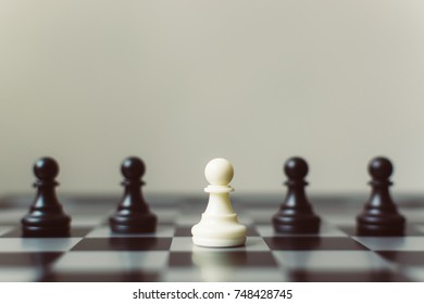 Chess board game white pawn different black pawn, Unique, think different, individual and standing out from the crowd concept - Shutterstock ID 748428745