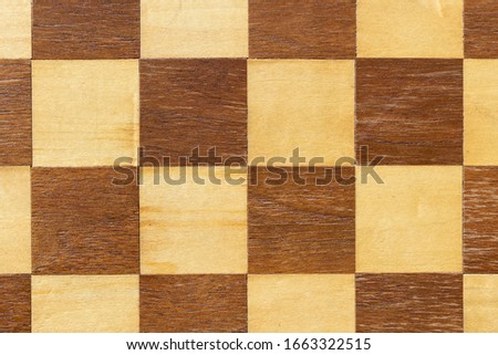 Chess board made of wood close up. Background