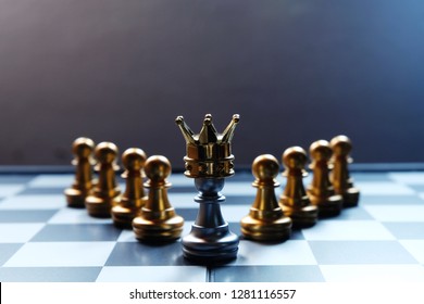 Chess Board. A Silver Pawn Wearing Crown. Business Leadership Concept. Copy Space For Text.