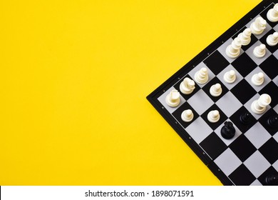 Chess board, white and black chess figures on yellow background. Flat lay,copy space. Competition.  - Shutterstock ID 1898071591