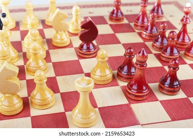 Chess Board With Wooden Pieces During The Game Close Up.