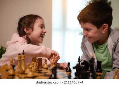 Chess game for clever mind. Kids having great time together playing chess. Logic development, leisure board games, entertainment, intelligent hobby and education concept - Shutterstock ID 2111465774