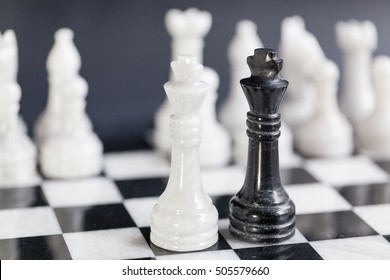 Chess Kings Facing Each Other As A Business Concept - Merger & Partnership, Or Showdown, Corporate Takeover, Strategy, Competition, Opposition, Confrontation, Politics, Leadership, Challenge, Survival