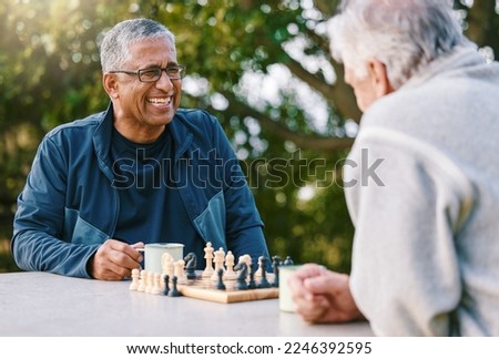 Chess, nature and retirement with senior friends playing a boardgame while bonding outdoor during summer. Park, strategy and game with a mature man and friend thinking about the mental challenge